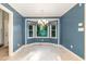 Well-lit dining room featuring tile floor, a chandelier and a bay window, offering plenty of natural light at 6820 Chamonix Pl, Raleigh, NC 27613