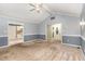 Bright living room with neutral walls, vaulted ceiling, and entry to kitchen and front entrance at 6820 Chamonix Pl, Raleigh, NC 27613