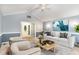 Cozy living room with neutral-toned furniture, large windows, and stylish decor at 6820 Chamonix Pl, Raleigh, NC 27613