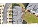 Aerial view of townhomes with gray roofs and sidewalk at 710 Samuel Cary Dr, Cary, NC 27511