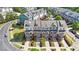 Overhead view of colorful townhomes with landscaping, front porches, individual garages, and common areas at 710 Samuel Cary Dr, Cary, NC 27511