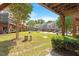 Community backyard space with well-maintained green grass and mature trees at 710 Samuel Cary Dr, Cary, NC 27511