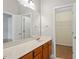 Bathroom with a large vanity, modern fixtures, and doorway to a closet at 710 Samuel Cary Dr, Cary, NC 27511