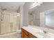 Bathroom with a large vanity, modern fixtures, and glass shower doors at 710 Samuel Cary Dr, Cary, NC 27511