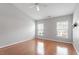 Light-filled bedroom with hardwood floors and double windows at 710 Samuel Cary Dr, Cary, NC 27511