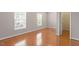Bedroom with hardwood floors and two windows that provide natural light at 710 Samuel Cary Dr, Cary, NC 27511