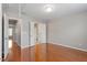 Large bedroom with a ceiling fan, hardwood floors, and neutral paint at 710 Samuel Cary Dr, Cary, NC 27511
