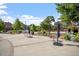Outdoor seating area with mature shade trees and manicured landscaping at 710 Samuel Cary Dr, Cary, NC 27511