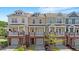 Charming townhomes featuring colorful exteriors, individual garages, and welcoming front porches at 710 Samuel Cary Dr, Cary, NC 27511