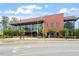 Exterior of Cary Regional Library, showcasing modern architecture and landscaping along a street at 710 Samuel Cary Dr, Cary, NC 27511