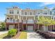 Inviting townhome exteriors featuring colorful facades, classic porches, and well-maintained landscaping at 710 Samuel Cary Dr, Cary, NC 27511