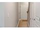 Neutral hallway with consistent decor and lots of doors leading to different rooms at 710 Samuel Cary Dr, Cary, NC 27511