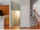 Open-concept area that transitions to stairs to the lower level and provides access to other spaces at 710 Samuel Cary Dr, Cary, NC 27511