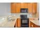 Well-equipped kitchen featuring granite countertops and stainless-steel appliances at 710 Samuel Cary Dr, Cary, NC 27511