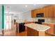 Modern kitchen with island, granite counters, and stainless steel appliances at 710 Samuel Cary Dr, Cary, NC 27511