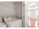 Convenient laundry area featuring washer and dryer and shelving at 710 Samuel Cary Dr, Cary, NC 27511
