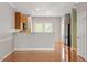 Bright living room showcasing hardwood floors and an open layout to the kitchen at 710 Samuel Cary Dr, Cary, NC 27511