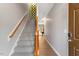 Inviting stairway featuring wood railings and leading to a living space at 710 Samuel Cary Dr, Cary, NC 27511