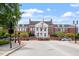 Street view of a brick building with symmetrical columns and design, enhanced by landscaping and sidewalk details at 710 Samuel Cary Dr, Cary, NC 27511