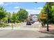 Street view showcasing a well-maintained road and sidewalks with a red brick building and lush greenery in the background at 710 Samuel Cary Dr, Cary, NC 27511