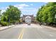Street view with a direct view of a prominent brick building, framed by lush greenery and well-maintained sidewalks at 710 Samuel Cary Dr, Cary, NC 27511