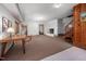 Large basement area with wood-paneled wall accent and a fireplace, offering versatile living space at 7723 Johnson Mill Rd, Bahama, NC 27503