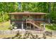 Charming two-story home featuring a screened-in porch and wooded backyard views at 7723 Johnson Mill Rd, Bahama, NC 27503