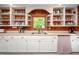 Kitchen featuring white countertops, open shelving and stainless steel sink at 7723 Johnson Mill Rd, Bahama, NC 27503