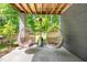 Outdoor patio featuring comfortable seating and a peaceful ambiance with scenic views at 7723 Johnson Mill Rd, Bahama, NC 27503
