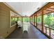 Inviting screened-in porch with a seating area, perfect for relaxation and enjoying nature at 7723 Johnson Mill Rd, Bahama, NC 27503
