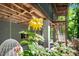 Close-up of a yellow rose on the porch, enhancing the outdoor appeal at 7723 Johnson Mill Rd, Bahama, NC 27503