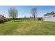 Large backyard, perfect for entertaining, that features a 2-car garage with a rooftop deck at 79 Blande Dr, Kenly, NC 27542