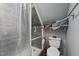 Cozy bathroom featuring a tiled shower and convenient storage shelves at 79 Blande Dr, Kenly, NC 27542