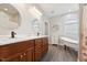 Bright bathroom with double vanity, soaking tub, and modern fixtures offers comfort and style at 79 Blande Dr, Kenly, NC 27542