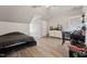 Bedroom with unique ceiling, light floors, and a black comforter showcases a practical space at 79 Blande Dr, Kenly, NC 27542