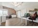 Bright bedroom boasting a brick accent wall, complemented by a ceiling fan and light-filled windows at 79 Blande Dr, Kenly, NC 27542