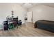 Bright room with unique ceiling, light floors, black comforter and a door leading to another room at 79 Blande Dr, Kenly, NC 27542