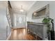 Spacious foyer with hardwood floors, decorative mirror, and staircase showcasing the home's interior design at 79 Blande Dr, Kenly, NC 27542