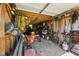 Garage space is full of tools, bikes, and gardening equipment at 79 Blande Dr, Kenly, NC 27542