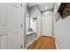 Welcoming hallway features a built-in window seat, coat rack, and hardwood flooring at 79 Blande Dr, Kenly, NC 27542