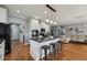 Open-concept kitchen with island, pendant lighting, and barstool seating, ideal for casual dining and entertaining at 79 Blande Dr, Kenly, NC 27542