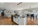 Kitchen island open to living and dining area with stainless steel sink and black hardware at 79 Blande Dr, Kenly, NC 27542