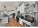 Modern kitchen with white cabinets, black countertops, stainless steel appliances, and stylish backsplash at 79 Blande Dr, Kenly, NC 27542