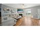 Comfortable living room with hardwood floors, a fireplace, and ample natural light, perfect for relaxation and gatherings at 79 Blande Dr, Kenly, NC 27542