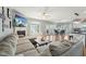 Cozy living room featuring a fireplace, large windows, and hardwood floors, creating a warm and inviting atmosphere at 79 Blande Dr, Kenly, NC 27542