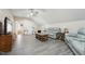 Bright living room featuring a ceiling fan, comfortable leather sofas, and a charming wooden coffee table at 79 Blande Dr, Kenly, NC 27542