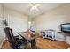 Inviting home office with hardwood floors, a ceiling fan, and a spacious wooden desk at 79 Blande Dr, Kenly, NC 27542