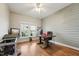 Well-lit office space featuring hardwood floors, a ceiling fan, and a charming window view at 79 Blande Dr, Kenly, NC 27542