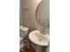 Bathroom featuring a stylish sink, toilet, and gold fixtures, creating an elegant and functional design at 807 W Trinity Ave # 144, Durham, NC 27701