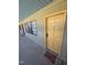 Apartment exterior with yellow door, black windows, and 'Shoes Off Homie' door mat at 807 W Trinity Ave # 144, Durham, NC 27701